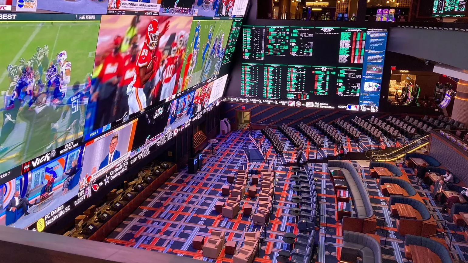 Big-screen sports lounge showing live match action